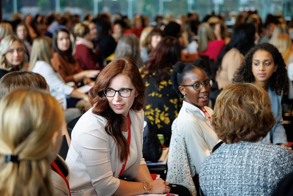 Attendees in conversation at a Bitcoin Poland session