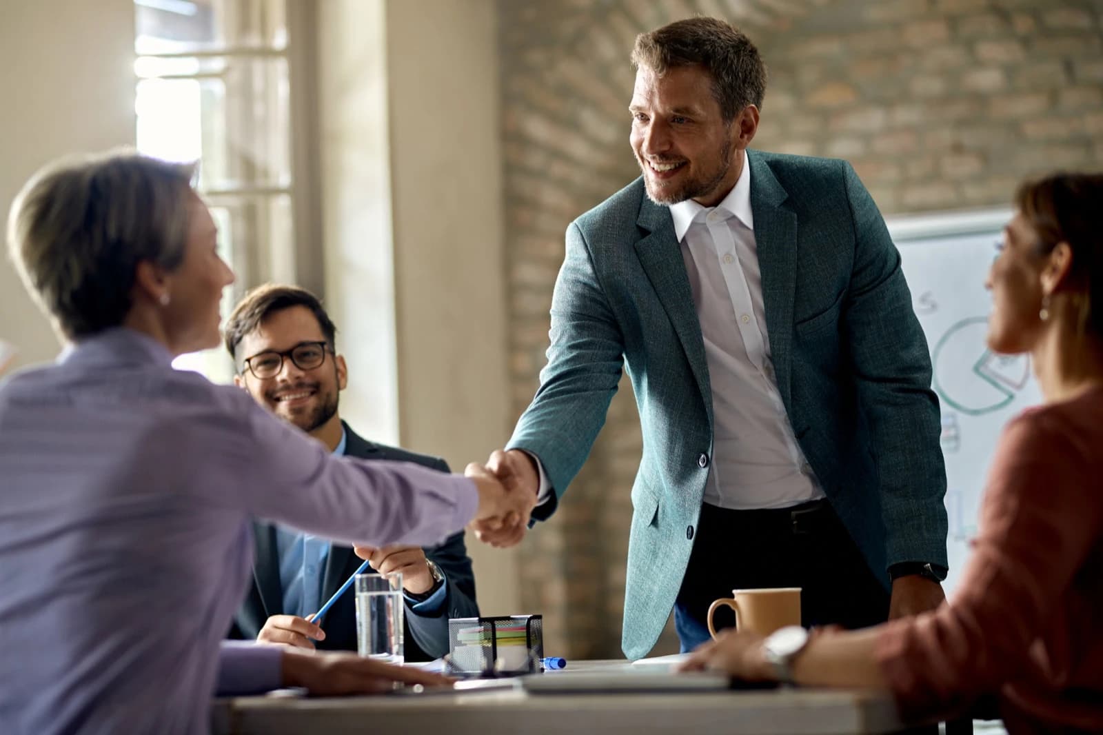 Business partners in conversation at Bitcoin Poland